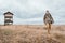 Hiker walking over grassland