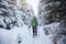 Hiker walking in winter Carpathian mountains