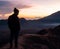 Hiker Watches Sunrise over Mount Bromo, Java, Indonesia