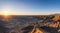 Hiker watching the sunrise at Moonscape Overlook