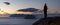 Hiker watching sunset above the Lofoten Islands, Norway