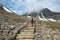 Hiker on Western footpath towards Kebnekaise peak Sweden