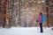 Hiker in winter forest. Sport, inspiration and travel