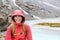 Hiker woman hiking with backpack in rain on trek