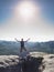 Hiker yelling with happiness on a mountain top. Man on top