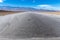 Hikers along the trail leading into Badwater Basin, Death Valley National Park, California, USA