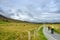 Hikers ascend a trail on a cloudy day in the Killarney National Park, Ireland