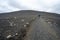 Hikers ascend trail to rim of Hverfjall crater east of Myvatn, Iceland.