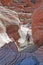 Hikers and Aztec sand stone rock formation in Red Rock Canyon, NV.