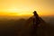 Hikers with backpacks relaxing on top of mountain