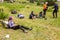 Hikers break on grassy lawn