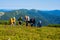 Hikers, company of friends collect and eat blueberries