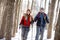 Hikers couple in winter hiking in forest
