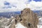 Hikers at the cross on the summit of Zugspitze