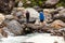 Hikers are crossing wooden bridge in highlands of Himalayas on M