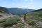 Hikers descend Saint Mary& x27;s Glacier Trail in Arapaho National Forest, Colorado.