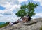 Hikers enjoy Hudson Valley view at the summit of Bear Mountain.