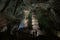 Hikers exploring a dramatic cave