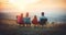 Hikers family sitting in tourist chairs and looking at mountain landscape at sunrise