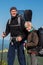 Hikers - father and smiling teenage daughter with backpacks