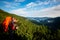 Hikers - father and teenage daughter with backpacks