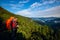 Hikers - father and teenage daughter with backpacks