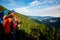 Hikers - father and teenage daughter with backpacks