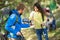 Hikers girl gives drink to her male friend