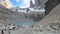 Hikers at glacier lake below Torres del Paine formation