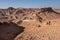 Hikers on a hiking trail in a remote desert region.