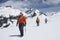 Hikers Joined By Safety Line On Snowy Mountains