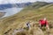 Hikers in the lagoon of Mojanda