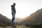 Hikers looking at the stunning landscape in the mountains during sunrise