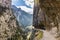 Hikers by a narrow mountain footpath