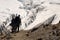 Hikers overlooking crevasse