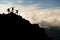 Hikers reaching peak at sunset