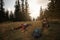 Hikers resting on grass after a long wilderness trek