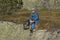 Hikers resting sitting on a rock in the Alps