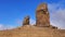 Hikers at the Roque Nublo big rock mountain Volcanic rock in caldera of Tejeda