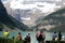 Hikers on shores of lake Louise, Alberta, Canada