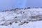 Hikers on the snow-covered mountain road