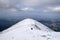 Hikers on snowy mountain