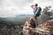 Hikers stand on top of a mountain