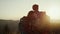 Hikers standing on top of mountain. Loving couple hiking in mountains