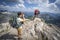 Hikers take pictures on a rocky mountain of the Allgau Alps