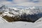 Hikers on the Tilicho Lake trek on the Annapurna circuit, walking through snow, surrounded by snow covered mountains. Himalayas, N