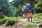 hikers on the trail in the Islandic mountains. Trek in National Park Landmannalaugar, Iceland. valley is covered with bright green