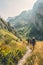 Hikers trekking through mountain trails, high in the mountain. Nature landscape.