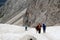 Hikers trekking in the snow Sassolungo, Italy