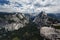Hikers view Half Dome Mountain clearly in mountain landscape